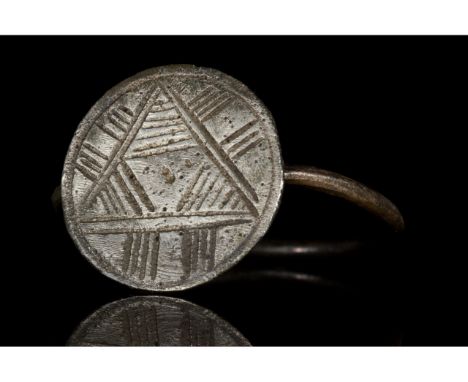 Ca. 1100-1400 AD. Crusaders Period. A wearable silver ring comprising a thin round band and an applied circular, flat bezel w