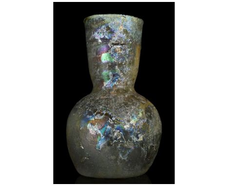 Ca. 100-300 AD. Roman. A beautiful glass flask with a spherical body with an attractive rainbow iridescence, a flaring cylind