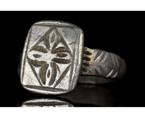 Ca. 1100-1400 AD. Crusaders Period. A beautiful silver ring comprising a circular band, linearly decorated shoulders, and an 