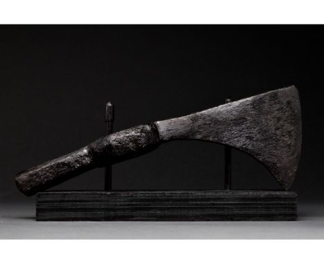 Ca. 1000-1200 AD. Viking Age. An iron axe head with a curved beard and cutting hedge, narrow circular socket, and heavy hamme