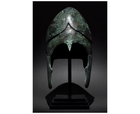 Ca. 500-300 BC. Greek. A beautiful example of a Chalcidian helmet. The bowl is forged in one piece, featuring high-arched eye