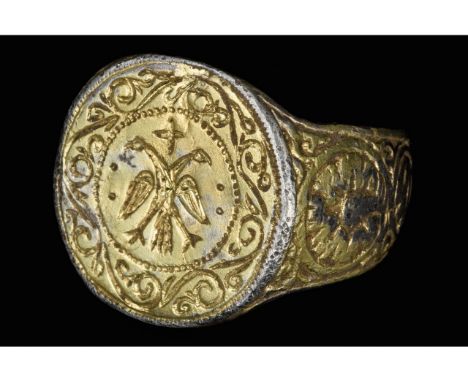 Ca. 1300-1500 AD. Late Byzantine period. A gilded silver ring with a D-section band and flared shoulders decorated with circu