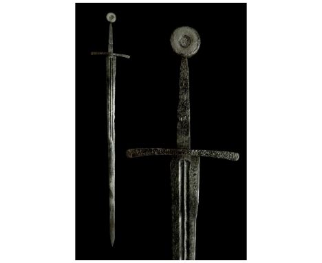 Ca. 1250-1370 AD. Medieval Western Europe. A beautiful forged Oakeshott type XIIIa longsword with a long grip and a disc-shap