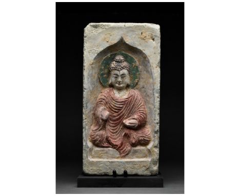 Ca. 386-534/535 AD. Northern Wei Dynasty. A terracotta tile featuring a beautiful depiction of a seated Buddha wearing garmen