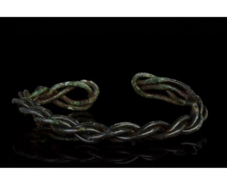 Ca. 900-1100 AD. Early Medieval. A beautiful Viking-ispired twisted 'fealty' bracelet or arm ring. Good condition; beautiful 