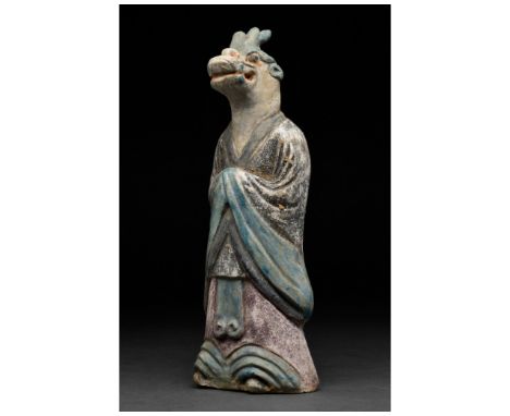 Ca. 1368-1644 AD. Ming Dynasty. An elaborate terracotta zodiac figure in a court dress or shenyi consisting of a long waistco