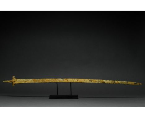 Ca. 400-600 AD. Migration Period. A long iron sword with a long, pointed, bevelled blade, a rectangular guard, and a rectangu