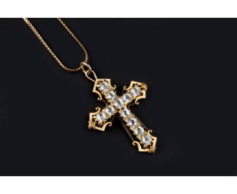 A CROSS PENDANT ON CHAIN, the openwork cross with stylised scrolled terminals and foliate accents, centred with lines of cush