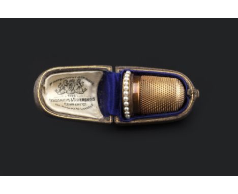 A COLLECTION OF JEWELLERY, comprising a half pearl set thimble, in fitted Goldsmiths & Silversmiths Company Ltd case, a half 