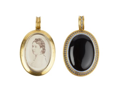 A VICTORIAN ONYX AND ENAMEL MEMORIAL LOCKET PENDANT BY PHILLIPS BROTHERS & SON, circa 1870, the oval cabochon black onyx with