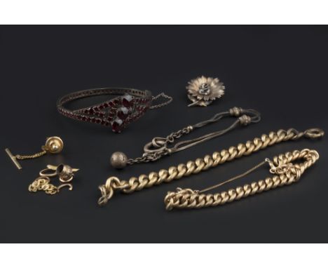 A SMALL COLLECTION OF JEWELLERY, comprising a Bohemian garnet bangle, of hinged crossover design, two gilt metal curb-link br