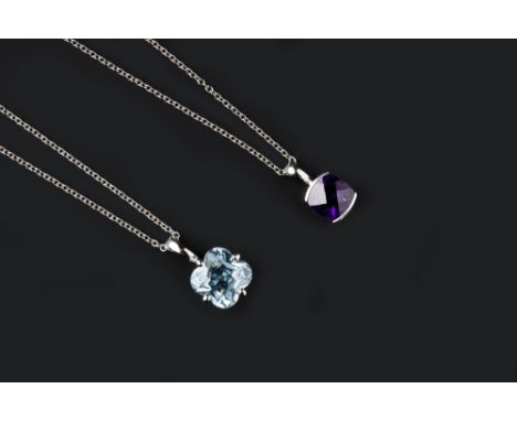 TWO GEM SET PENDANTS, comprising an amethyst single stone pendant, the cushion-shaped fancy-cut amethyst in white precious me