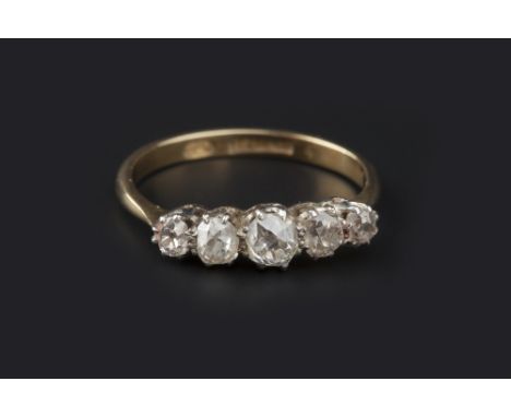 A DIAMOND FIVE STONE RING, the graduated cushion-shaped old-cut diamonds in claw setting, to shank stamped '18ct & pt', total