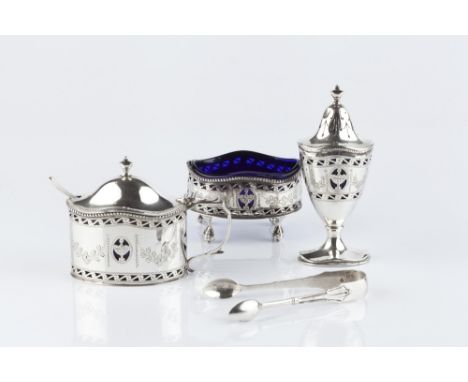 A SILVER THREE PIECE CRUET SET, comprising mustard, salt and urn shaped pepper, with pierce decorated and engraved decoration