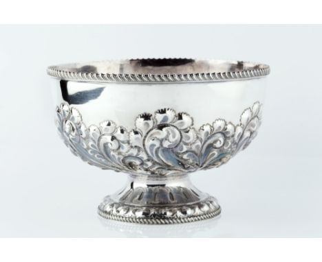 A LATE VICTORIAN SILVER ROSE BOWL, repoussé decorated with stylised scrolling foliage, and gadrooned border, by Atkin Bros, S