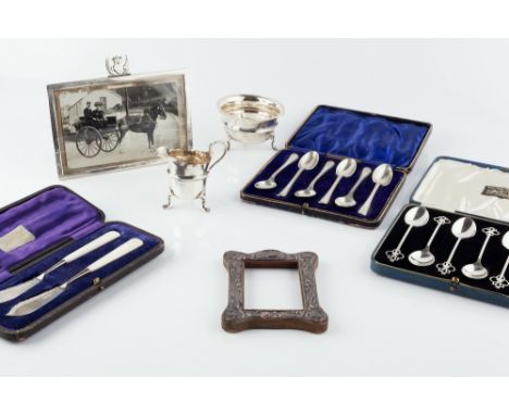 A SILVER BACHELOR'S MILK JUG and sugar basin by John Rose, Birmingham 1903, 3 oz; a Victorian silver rectangular photo frame,