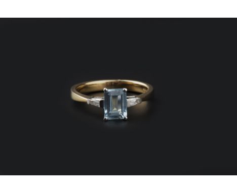 AN AQUAMARINE AND DIAMOND THREE STONE RING,  the rectangular step-cut aquamarine in four claw setting, between two tapered ba