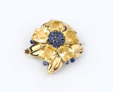 A YELLOW AND BLUE SAPPHIRE 'PASSE-PARTOUT' FLOWER BROOCH BY VAN CLEEF & ARPELS,  circa 1940, the stylised flowerhead of cushi