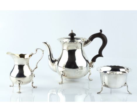 A MATCHED SILVER BACHELOR'S THREE PIECE TEA SERVICE, comprising teapot with ebonised handle and knop by Stokes & Ireland Ltd,