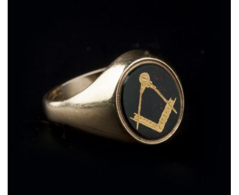 A MASONIC BLOODSTONE SIGNET RING AND A MASONIC MEDAL, the ring with an oval bloodstone panel inlaid with compass and set squa