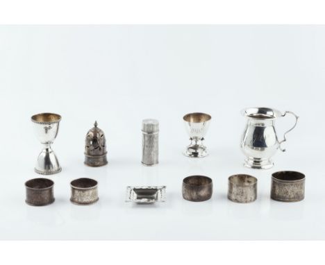 A SILVER BALUSTER CHRISTENING MUG by Henry Moreton, Birmingham 1919, 9cm high, 4 oz; a silver double ended egg cup; another s