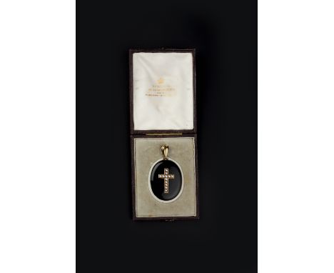 A VICTORIAN ONYX, HALF PEARL AND ENAMEL MEMORIAL PENDANT, the oval black onyx locket pendant applied with a half pearl Latin 