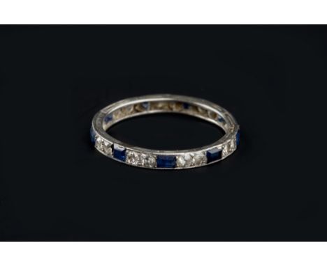 A SAPPHIRE AND DIAMOND FULL HOOP ETERNITY RING, millegrain set with alternate step-cut sapphires and pairs of old and brillia