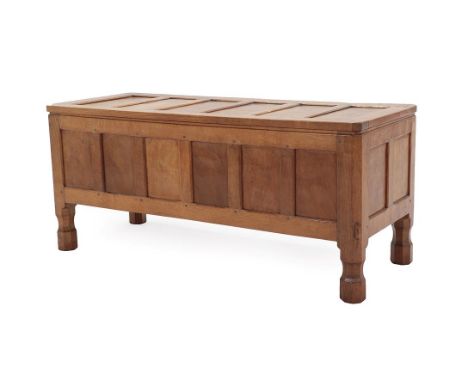 Workshop of Robert Mouseman Thompson (Kilburn): An English Oak Panelled Blanket Chest, adzed rectangular top, on four octagon