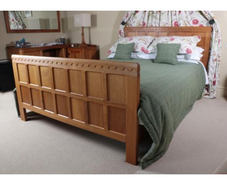 Workshop of Robert Mouseman Thompson (Kilburn): An English Oak 5ft Panelled Bedstead, the panelled headboard and footboard wi