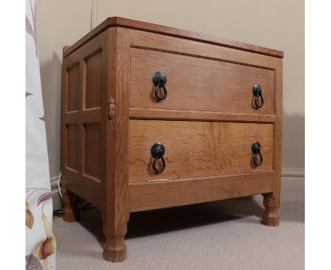 Workshop of Robert Mouseman Thompson (Kilburn): An English Oak Panelled Television DVD Table, with a single drawer above a fa