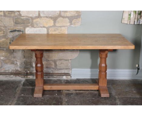 Workshop of Robert Mouseman Thompson (Kilburn): A 5ft English Oak Refectory Table, on two octagonal legs joined by a stretche