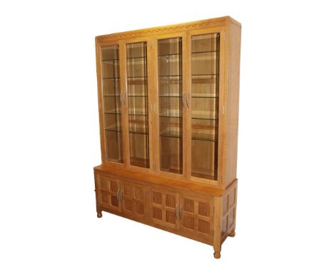 Workshop of Robert Mouseman Thompson (Kilburn): An English Oak Display Storage Cupboard, 2000, penny moulded top, illuminated