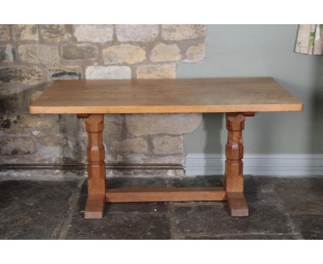 Workshop of Robert Mouseman Thompson (Kilburn): A 5ft English Oak Refectory Table, on two octagonal legs joined by a stretche