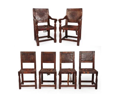 Robert Mouseman Thompson (1876-1955): A Set of Six (4+2) English Oak Panel Back Dining Chairs, 1920's/30's, the armchairs wit