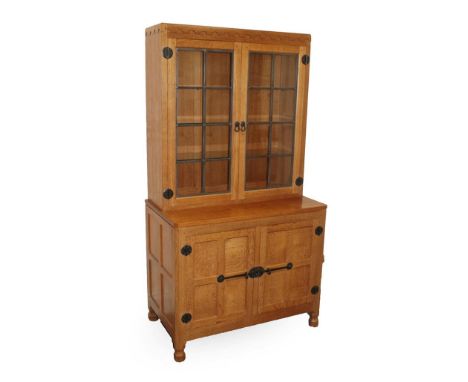 Workshop of Robert Mouseman Thompson (Kilburn): An English Oak Drinks' Display Cupboard, the glazed upper section with three 