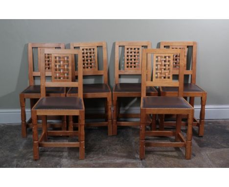 Workshop of Robert Mouseman Thompson (Kilburn): Six English Oak High Lattice Back Dining Chairs, chocolate cow hide seats, on