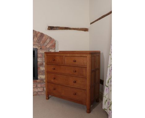 Workshop of Robert Mouseman Thompson (Kilburn): An English Oak Panelled Chest of Drawers, with raised upstand, above two shor