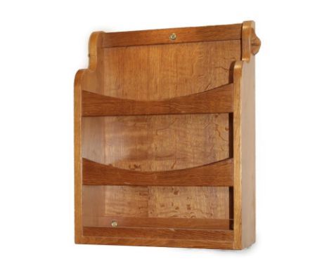 Coxwold Cabinet Makers: An English Oak Wall Mounted Leaflet Holder, with shaped sides and two bars, with carved unicorn trade