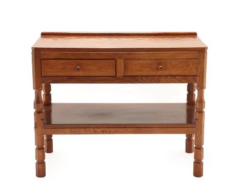 Workshop of Robert Mouseman Thompson (Kilburn): An English Oak Serving Table, with raised upstand, rectangular adzed top abov