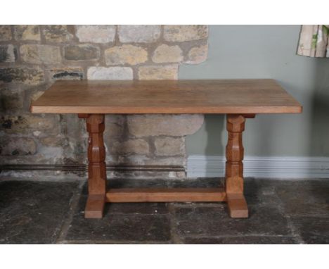 Workshop of Robert Mouseman Thompson (Kilburn): A 5ft English Oak Refectory Table, on two octagonal legs joined by a stretche