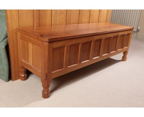 Workshop of Robert Mouseman Thompson (Kilburn): An English Oak Panelled Blanket Chest, rectangular adzed hinged top, on four 