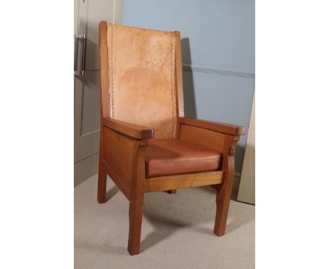 Workshop of Robert Mouseman Thompson (Kilburn): An English Oak Smoking Chair, slung leather back, straight arms, cow hide cov