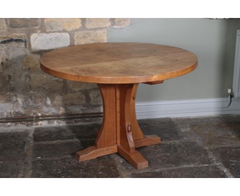 Workshop of Robert Mouseman Thompson (Kilburn): A 3' 8'' English Oak Circular Dining Table, on a cruciform base, with carved 