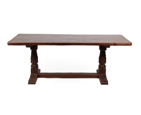 Robert Mouseman Thompson (1876-1955): An English Oak 6'6'' Refectory Dining Table, 1920's/30's, adzed both sides, dowelled th