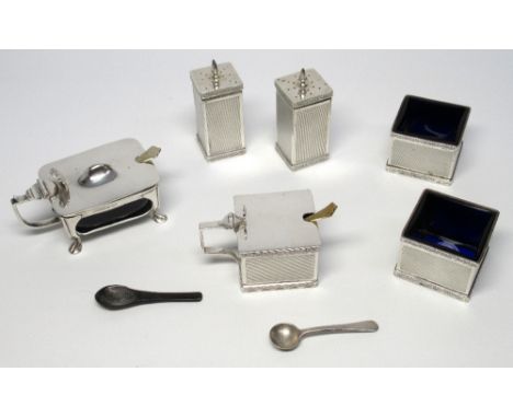 SILVER SQUARE SECTION FIVE PIECE CRUET EACH WITH ENGINE TURNED DECORATION, RIBBON AND FOLIATE BORDER AND THREE BLUE GLASS LIN