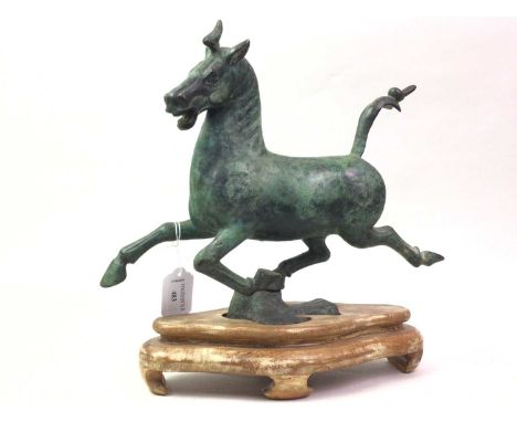 CHINESE BRONZE TANG-STYLE HORSE, modelled galloping, on hardwood base32cm wideGeneral surface ware, scratches , no other visi