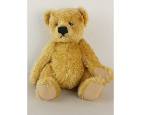 PELHAM PUPPET OF A POODLE, AND A STEIFF TEDDY BEAR the black poodle puppet in original box, the Steiff a 20th century blonde 