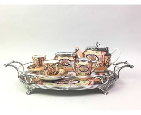 SPODE TETE A TETE, 19TH CENTURY  with plated mounts and with double handled tray, comprising two cups and saucers, teapot, su