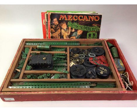 COLLECTION OF VINTAGE MECCANO, comprising parts and pieces from various sets, including an electric motor and instruction mag
