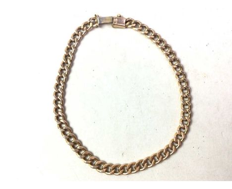 GOLD CURB LINK BRACELET, AND A GOLD NECK CHAIN  hallmarked for nine carat gold, along with a gold neck chain, also hallmarked